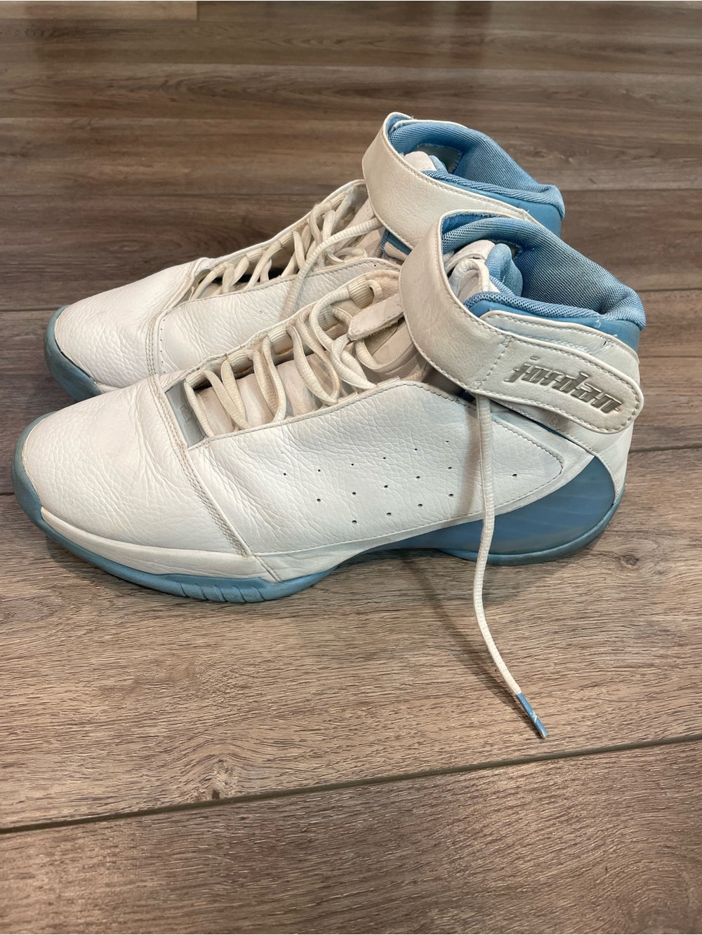 Air Jordans: White and Light Blue High-Top Basketball Sneakers